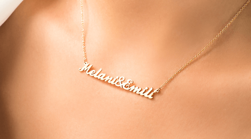 personalized gold necklace with two names on it on womans neck