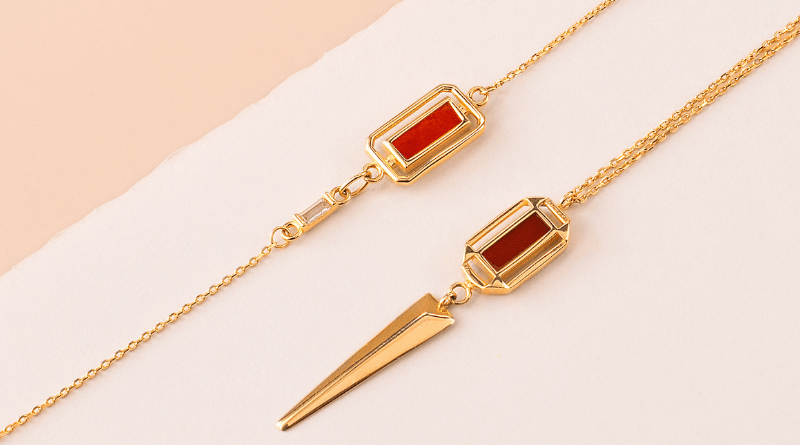gold necklace and bracelet with red squared stone