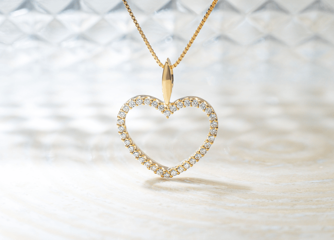diamond gold necklace with heart motif pendant made of diamonds