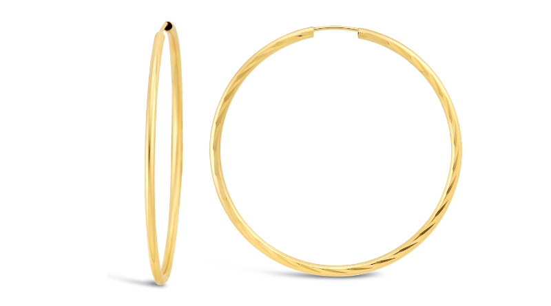gold jewelry round hoops earrings on white background