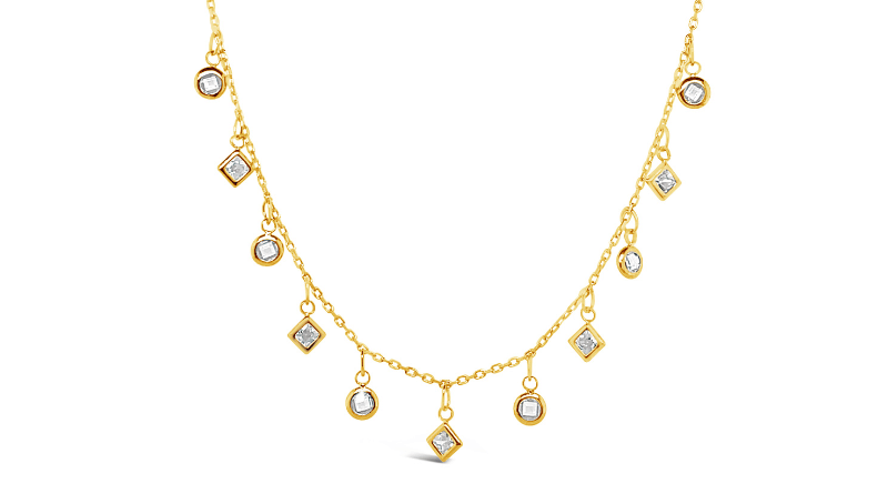 gold necklace with small zircon pendants on white background
