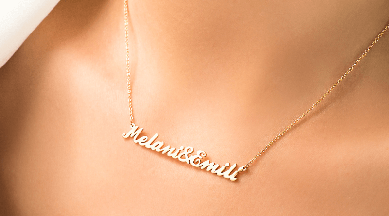 personalized gold necklace with names on womans neck