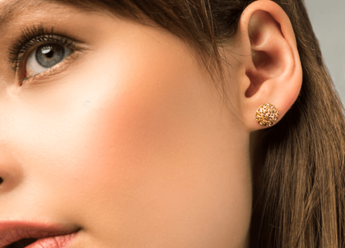 young woman wearing croatian traditional earrings