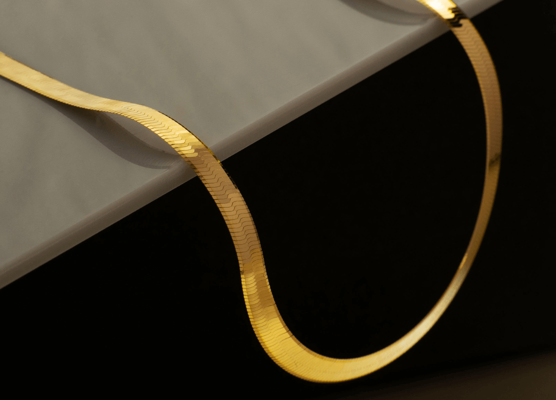 premium gold necklace on dark background scene photo
