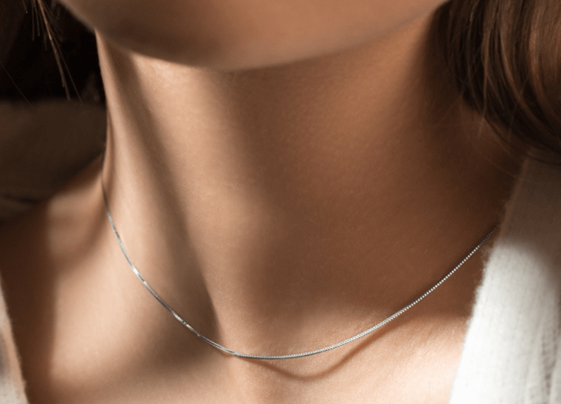 premium gold chain necklace on young woman