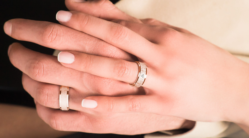 rose gold wedding rings on hands