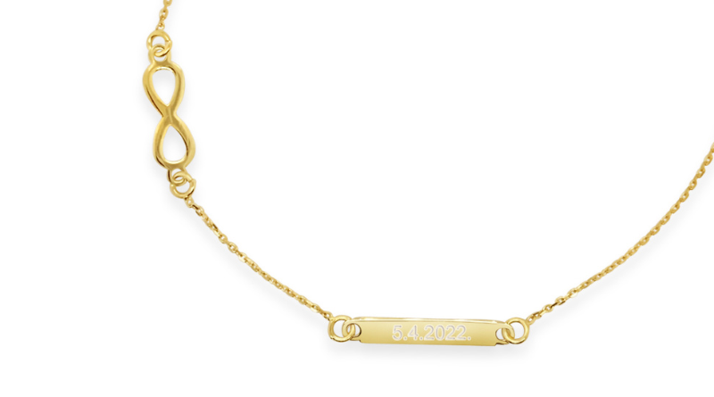 personalized jewelry 14kt gold date engraved bracelet on white background 